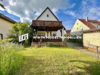 Vermietetes freistehendes Zweifamilienhaus mit Garage in Grafenrheinfeld - Außenansicht