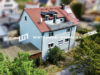 Interessantes großzügiges Zweifamilienhaus mit Dachterrasse in Niederwerrn - Außenaufnahme