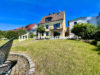 Gepflegtes Einfamilienhaus mit traumhaftem Garten und Garage in toller Aussichtslage - Rückseite