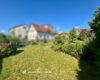 Ein-/Zweifamilienhaus mit vier Garagen, Scheune und Nebengebäuden sowie Gartenfläche - Garten